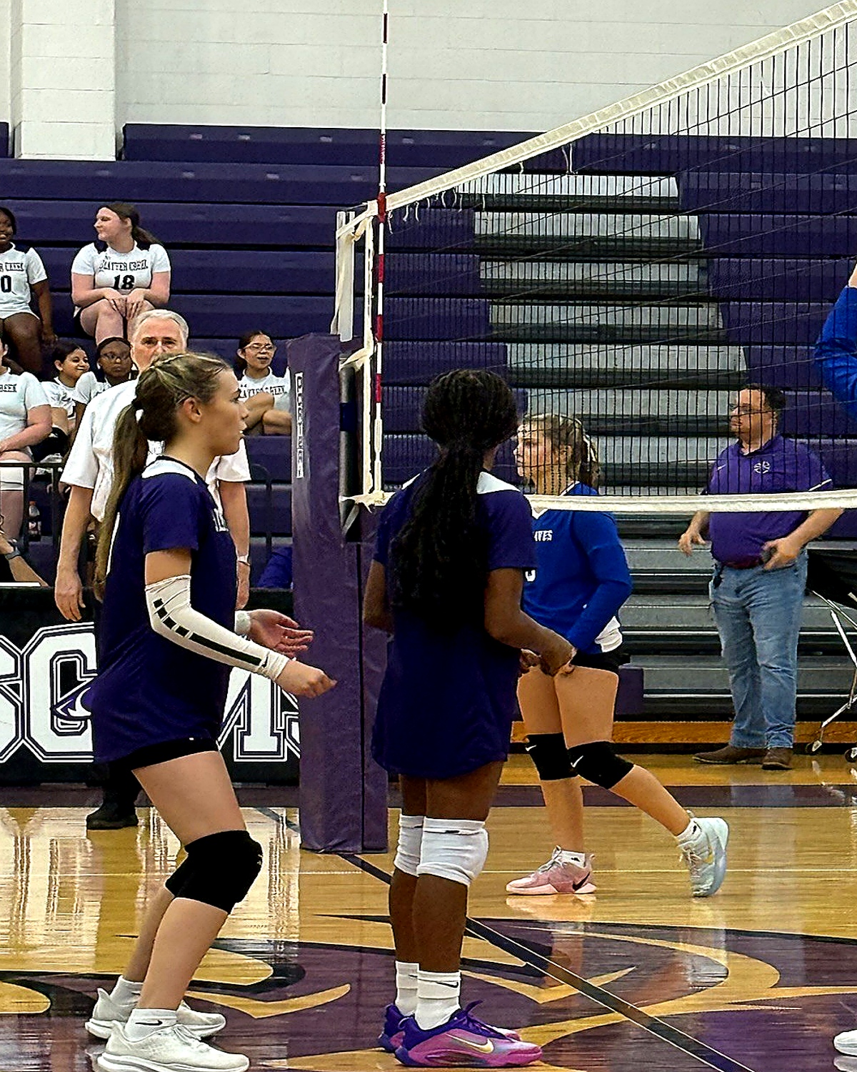 Jordan Young near the net with teammates